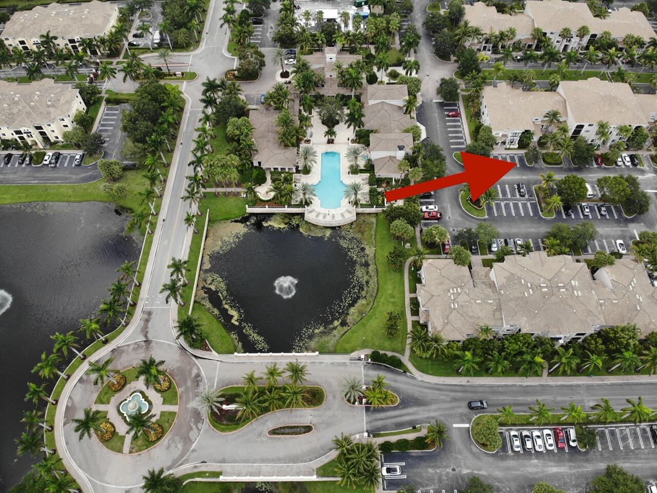 an aerial view of a house with a garden and pool