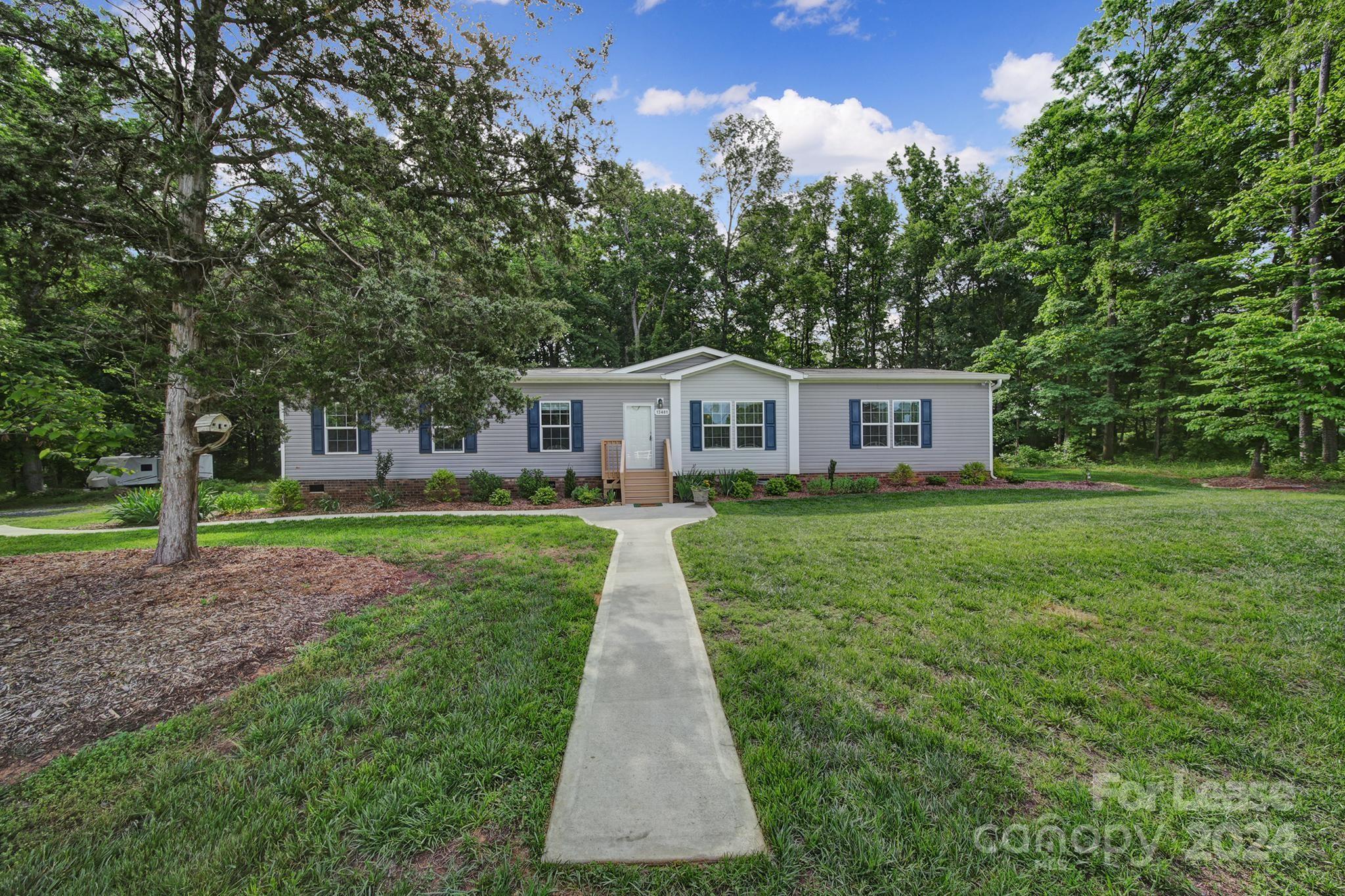 a front view of a house with yard