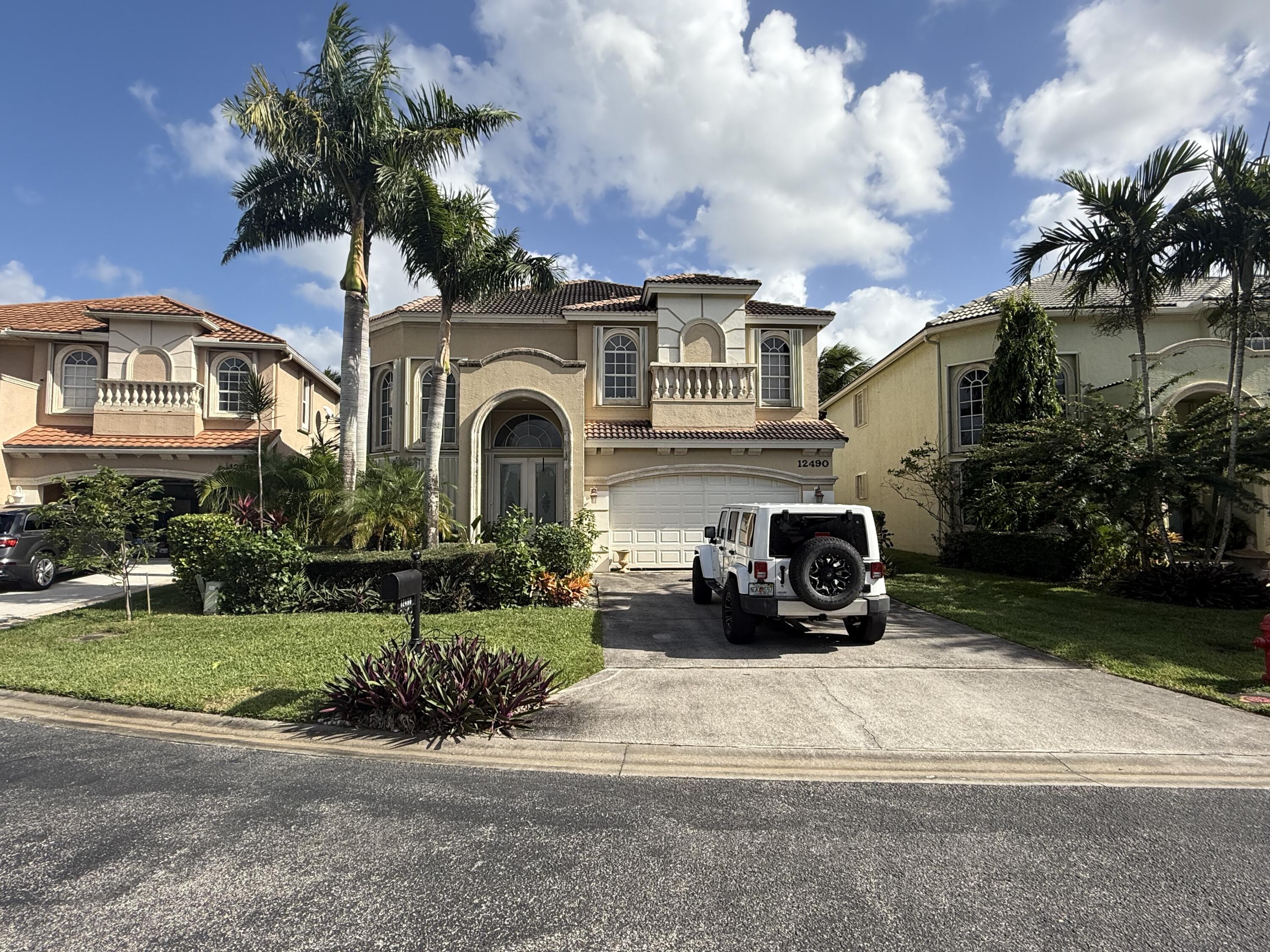 a view of a car parked in front of a house