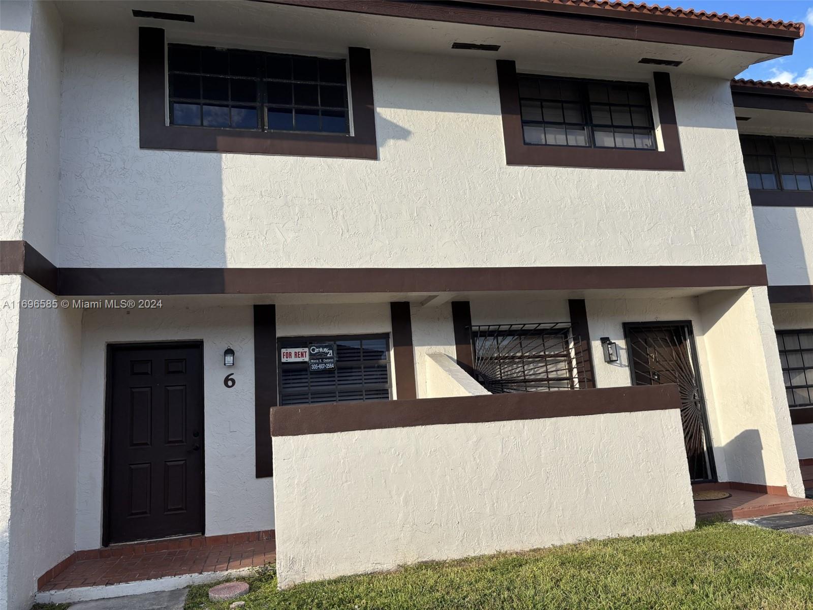 a view of the house with car parked