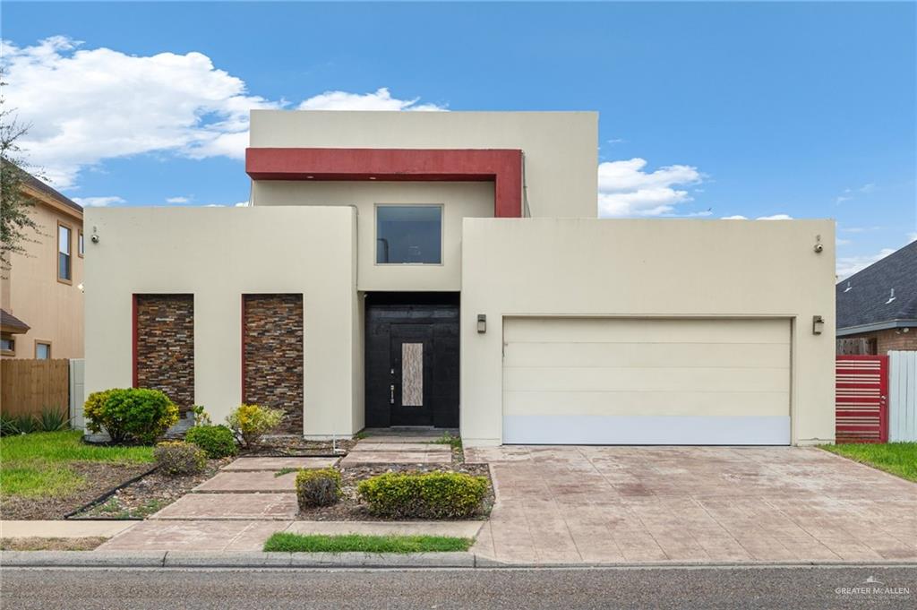 Contemporary home featuring a garage