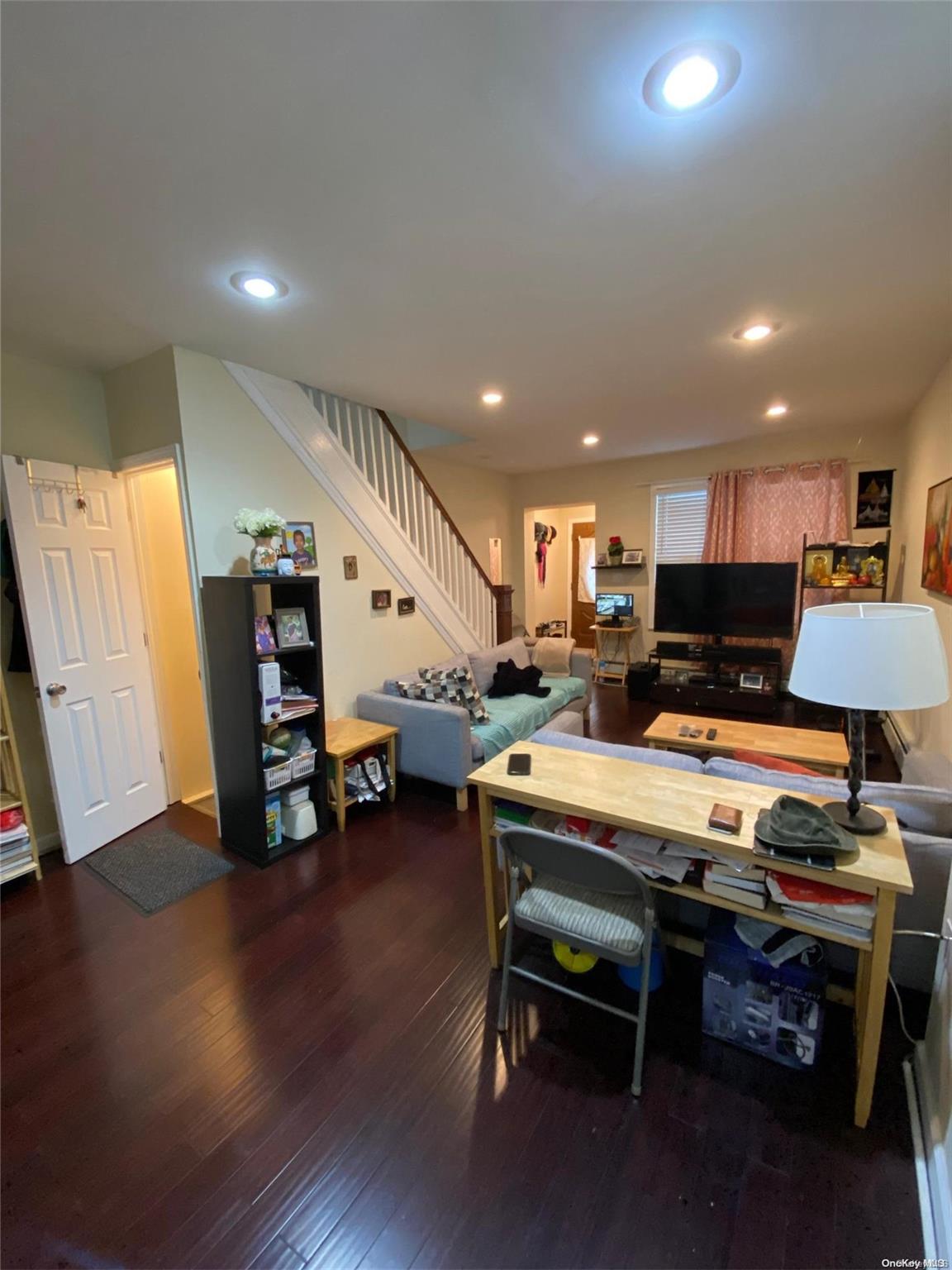 a room with furniture and a wooden floor