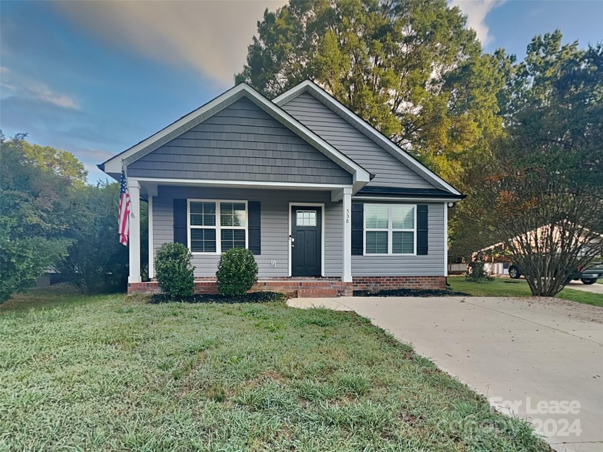 front view of a house with a yard