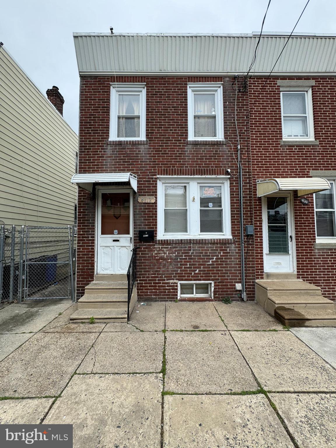 a front view of a house with parking space