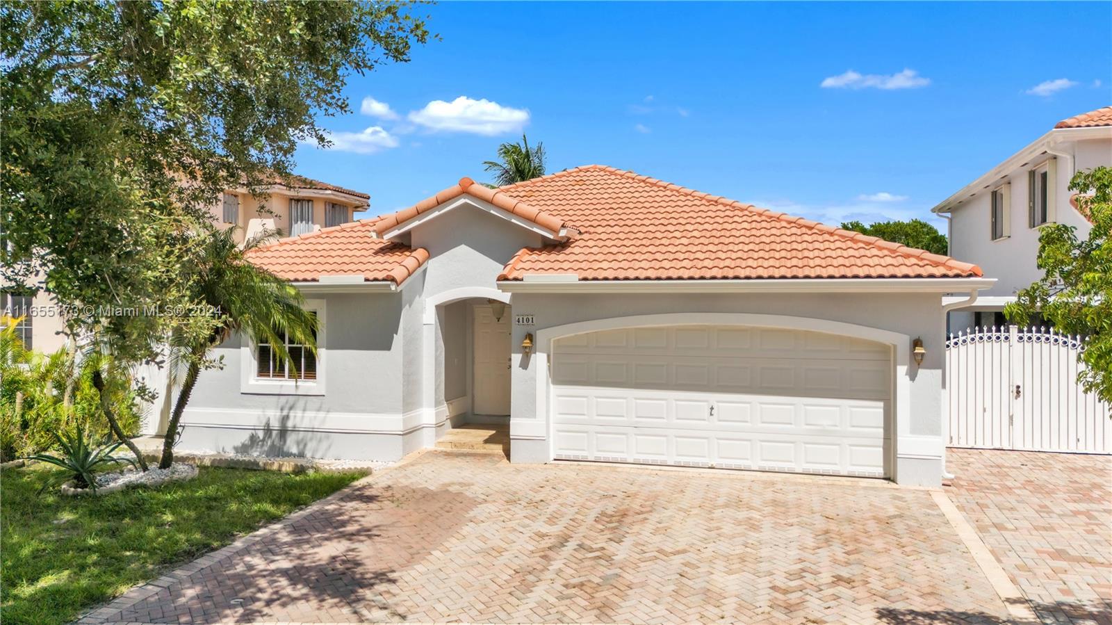 a front view of a house with a garage