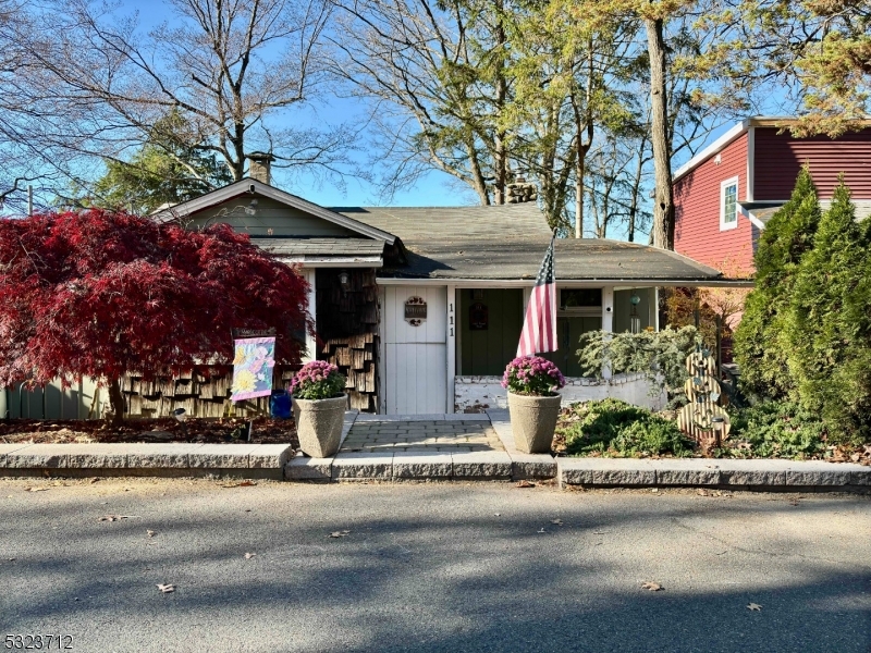 front view of a house with a small yard