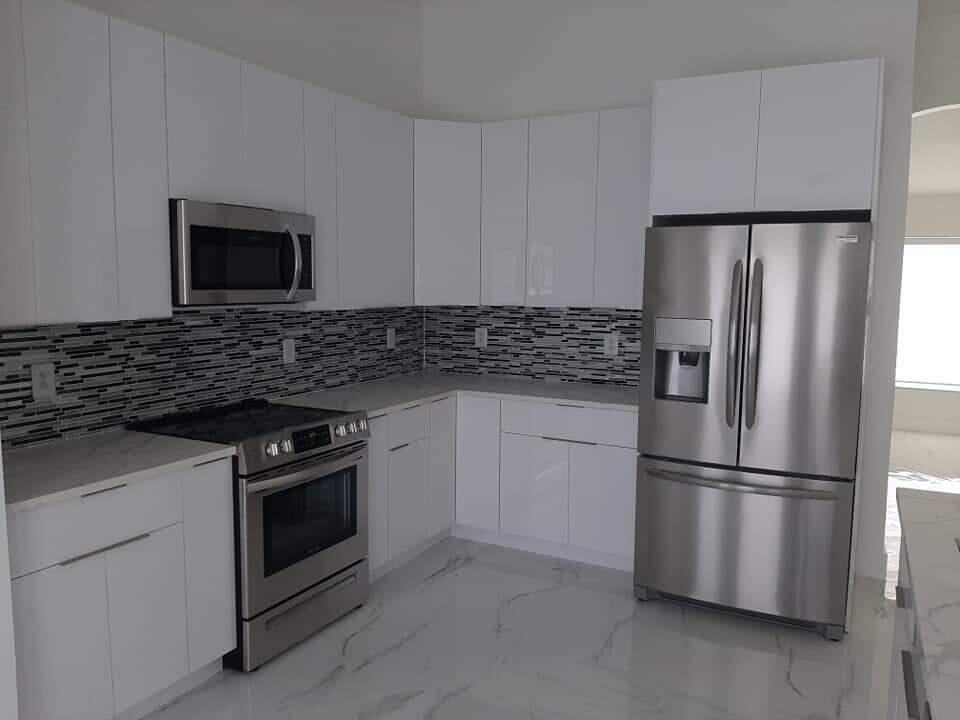 a kitchen with appliances cabinets and a counter top space