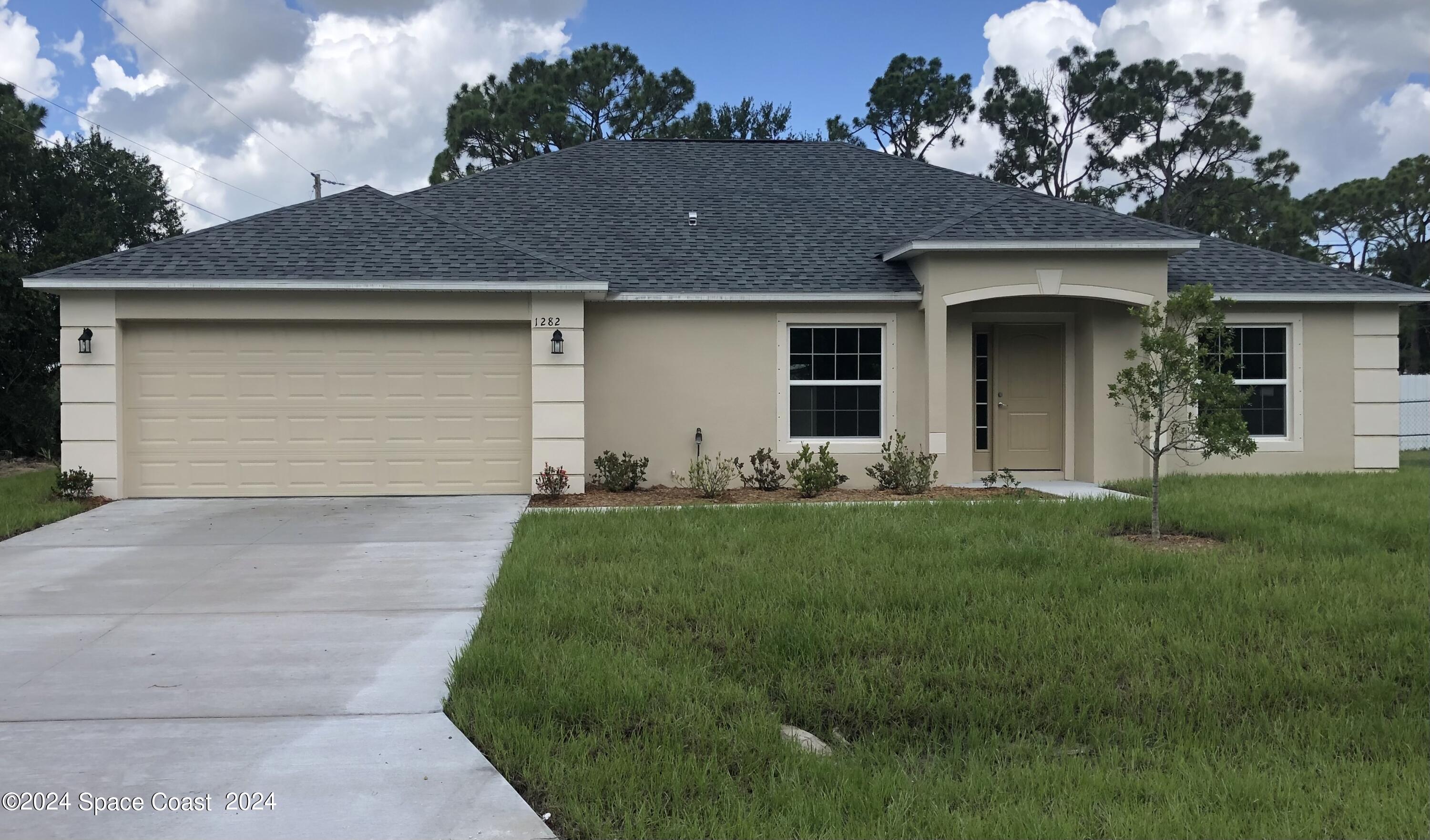 front view of house with a yard