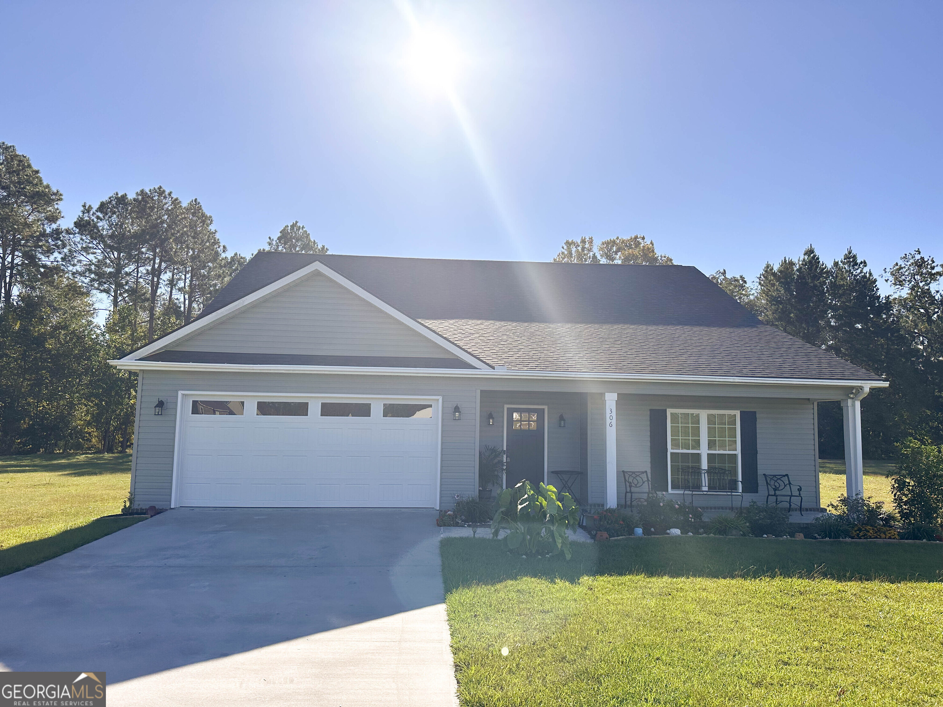 a front view of a house with garden