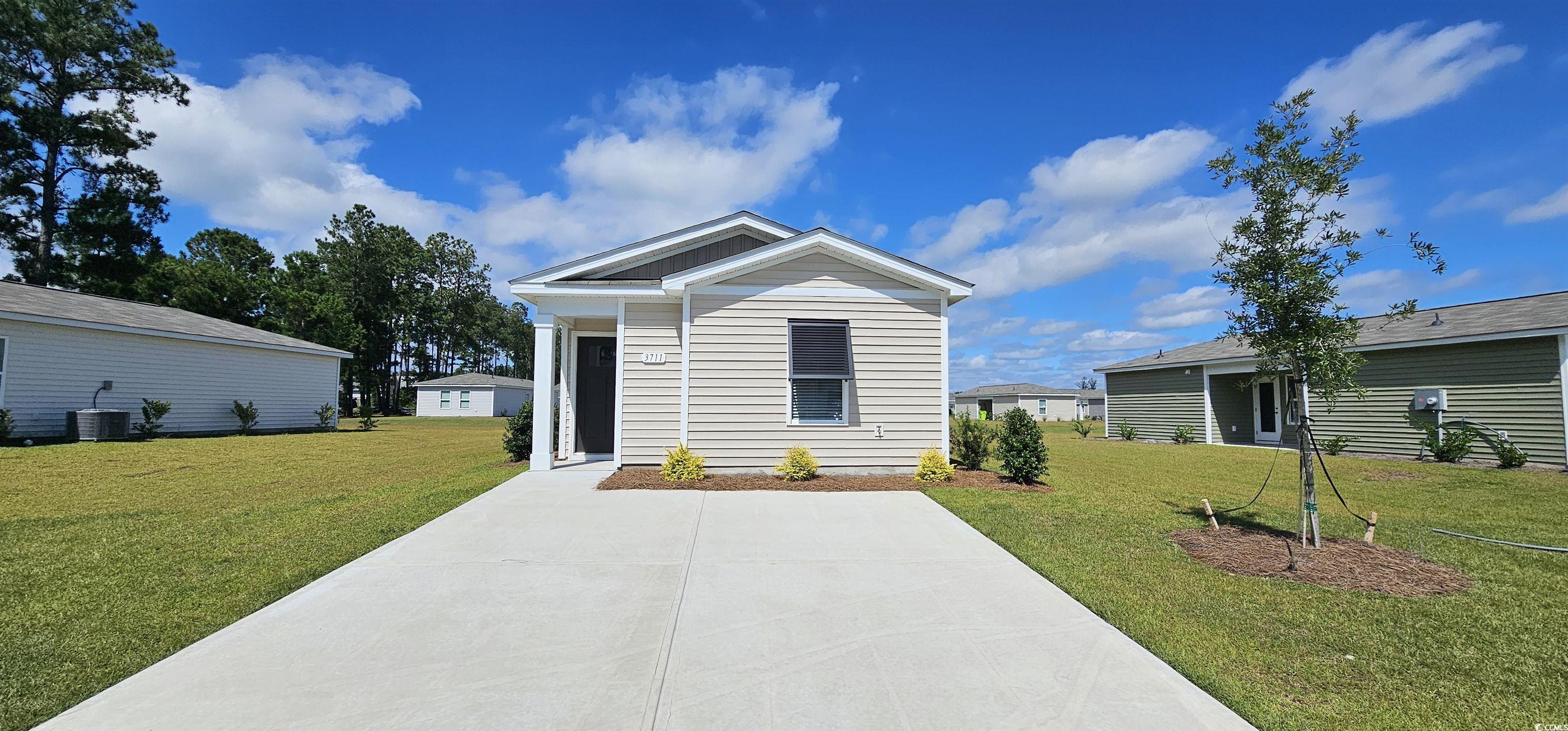 View of front of property with a front lawn and ce