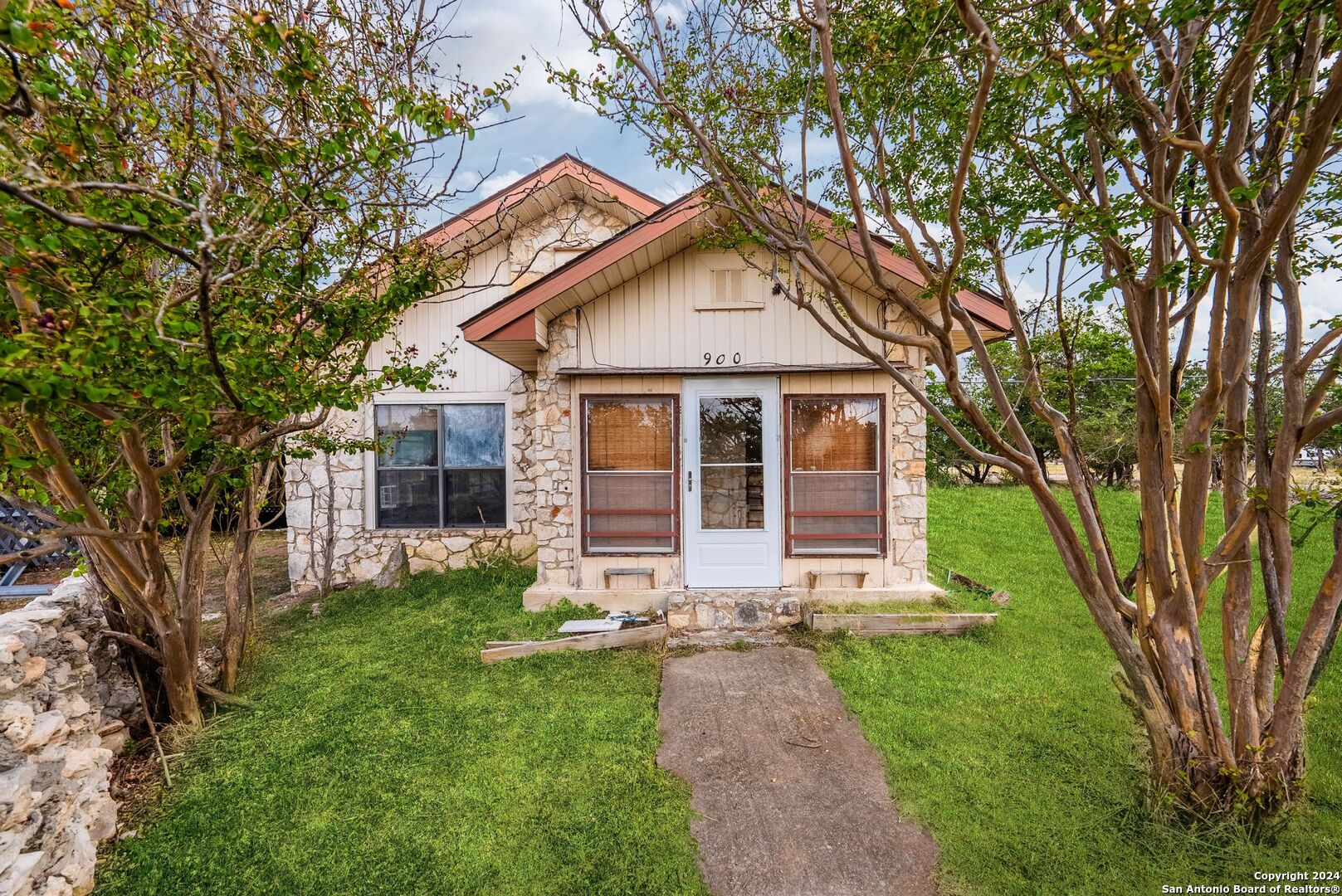 front view of a house with a yard