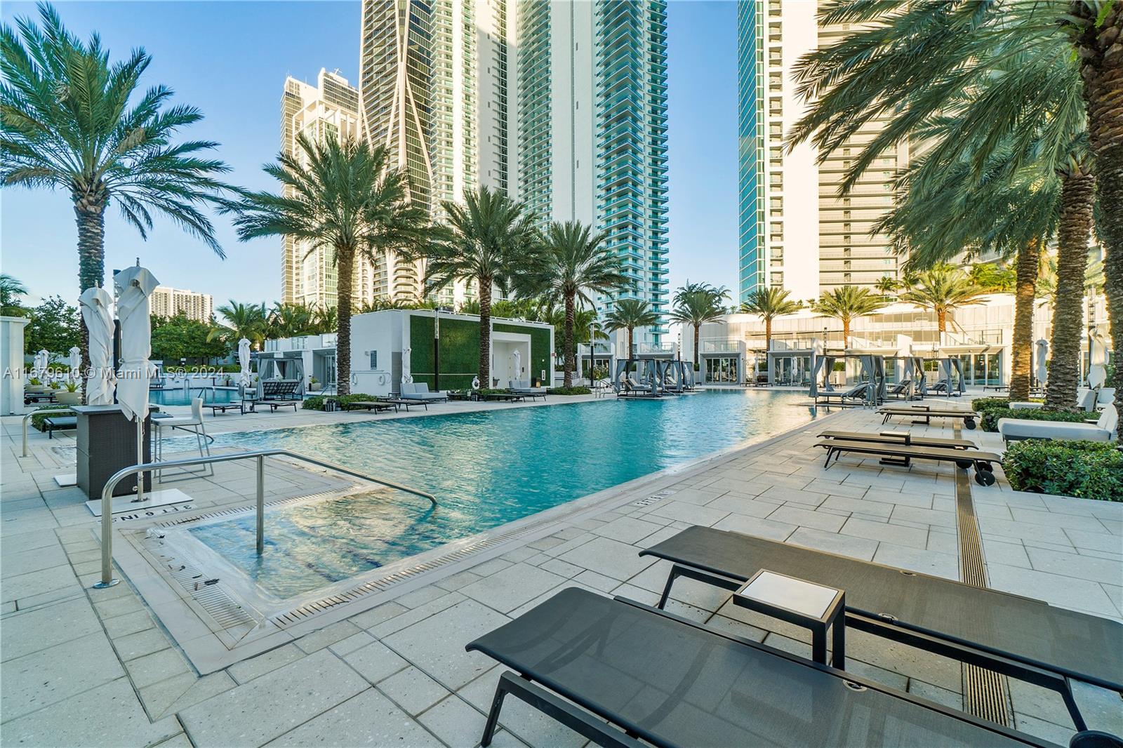 a view of swimming pool with outdoor seating