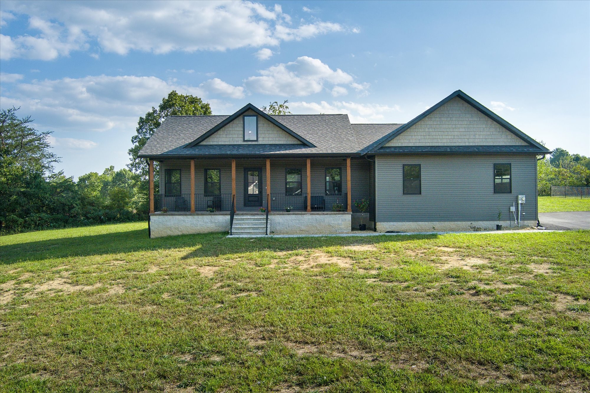 a front view of a house with garden