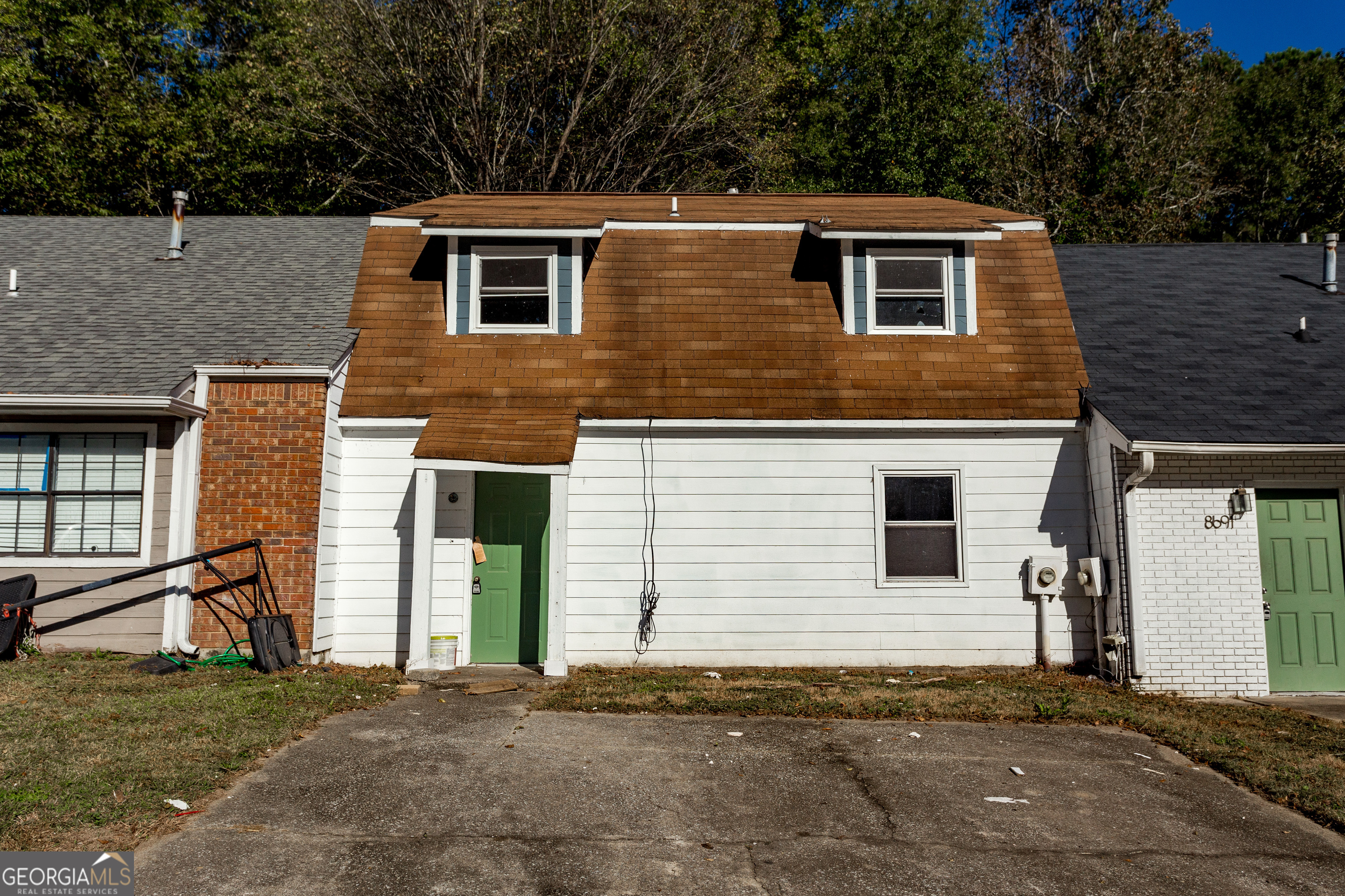 a front view of a house with a yard