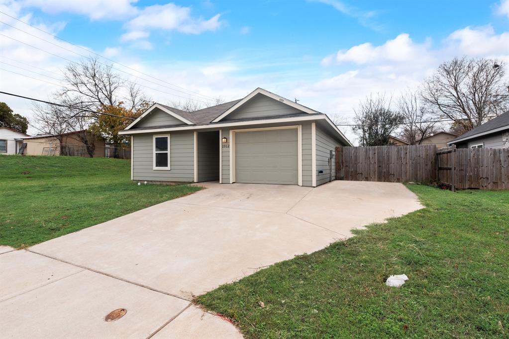 a front view of a house with yard