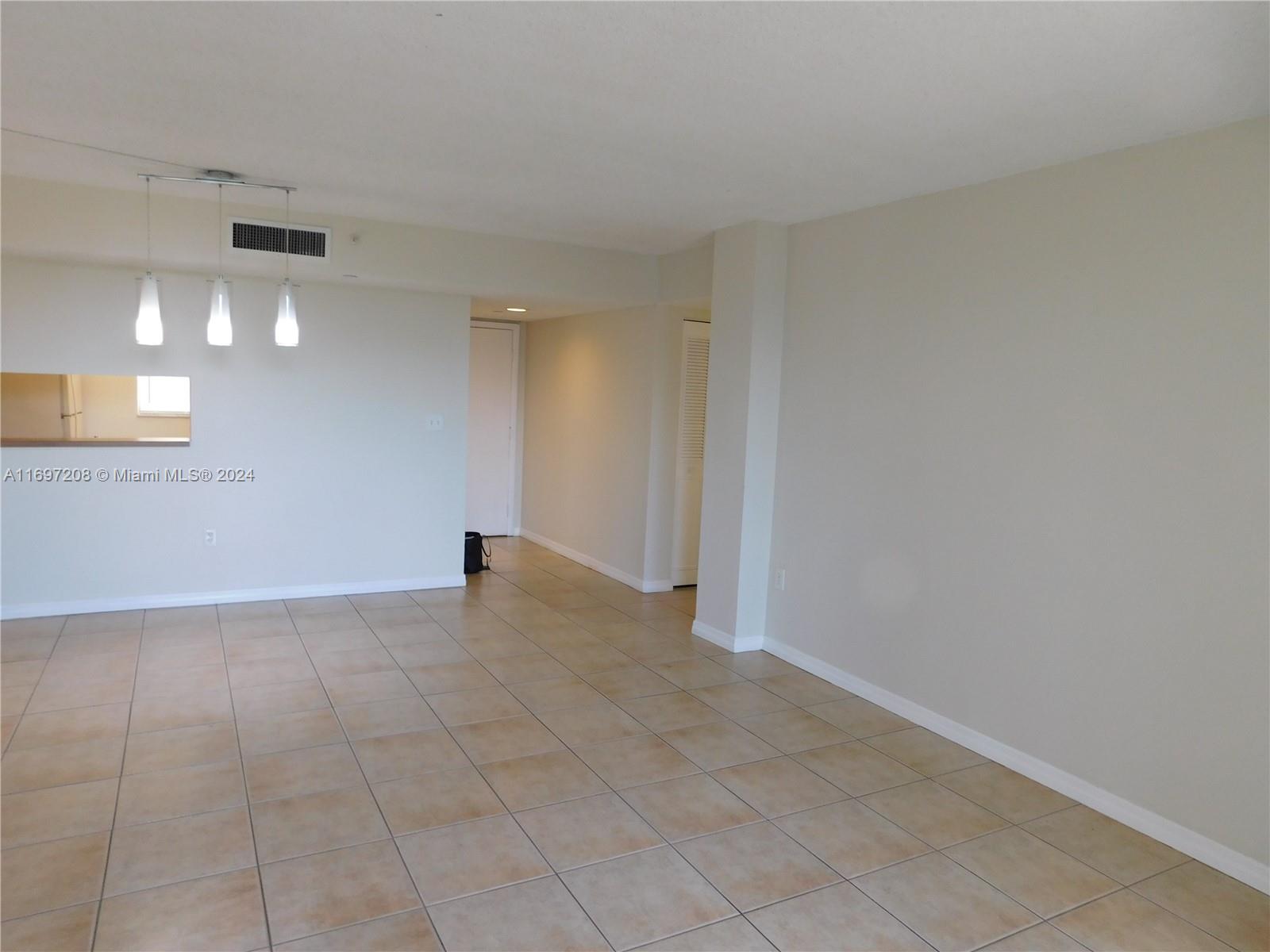 a view of an empty room and window