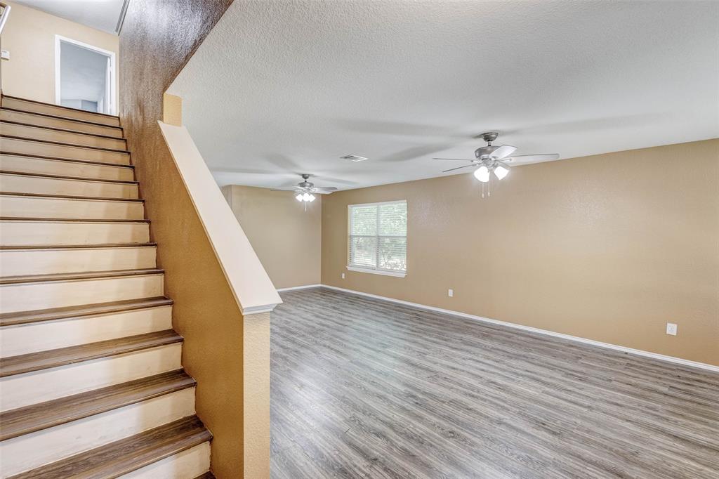 a view of an entryway with wooden floor