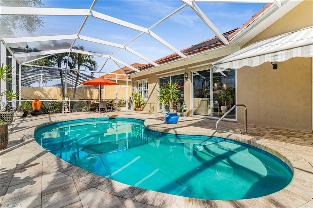 a view of a swimming pool with a patio