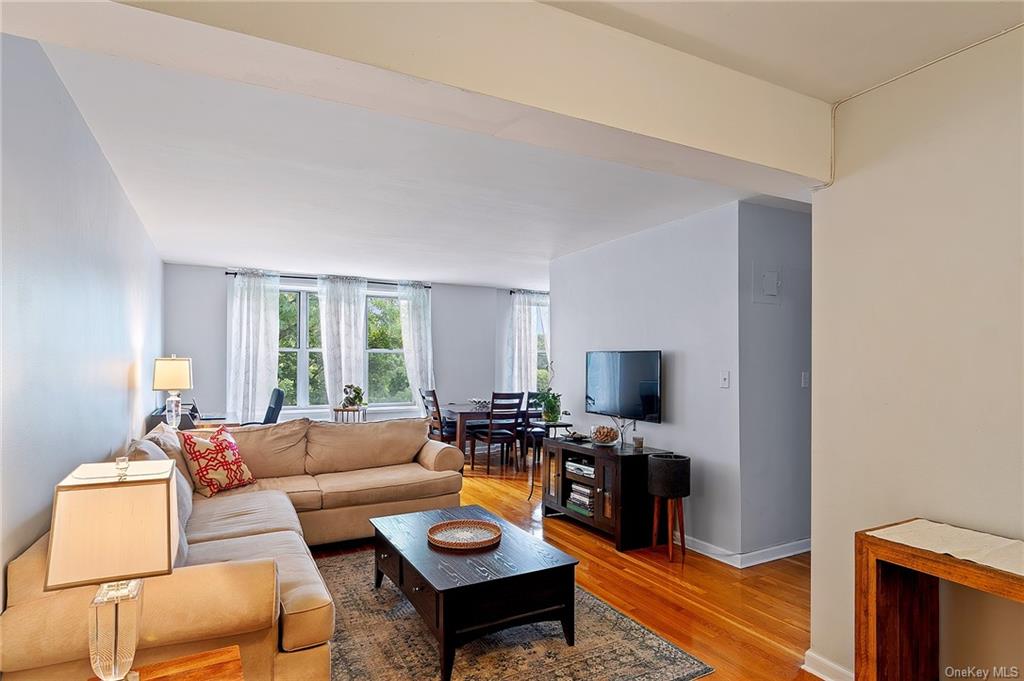 Living room with hardwood / wood-style flooring