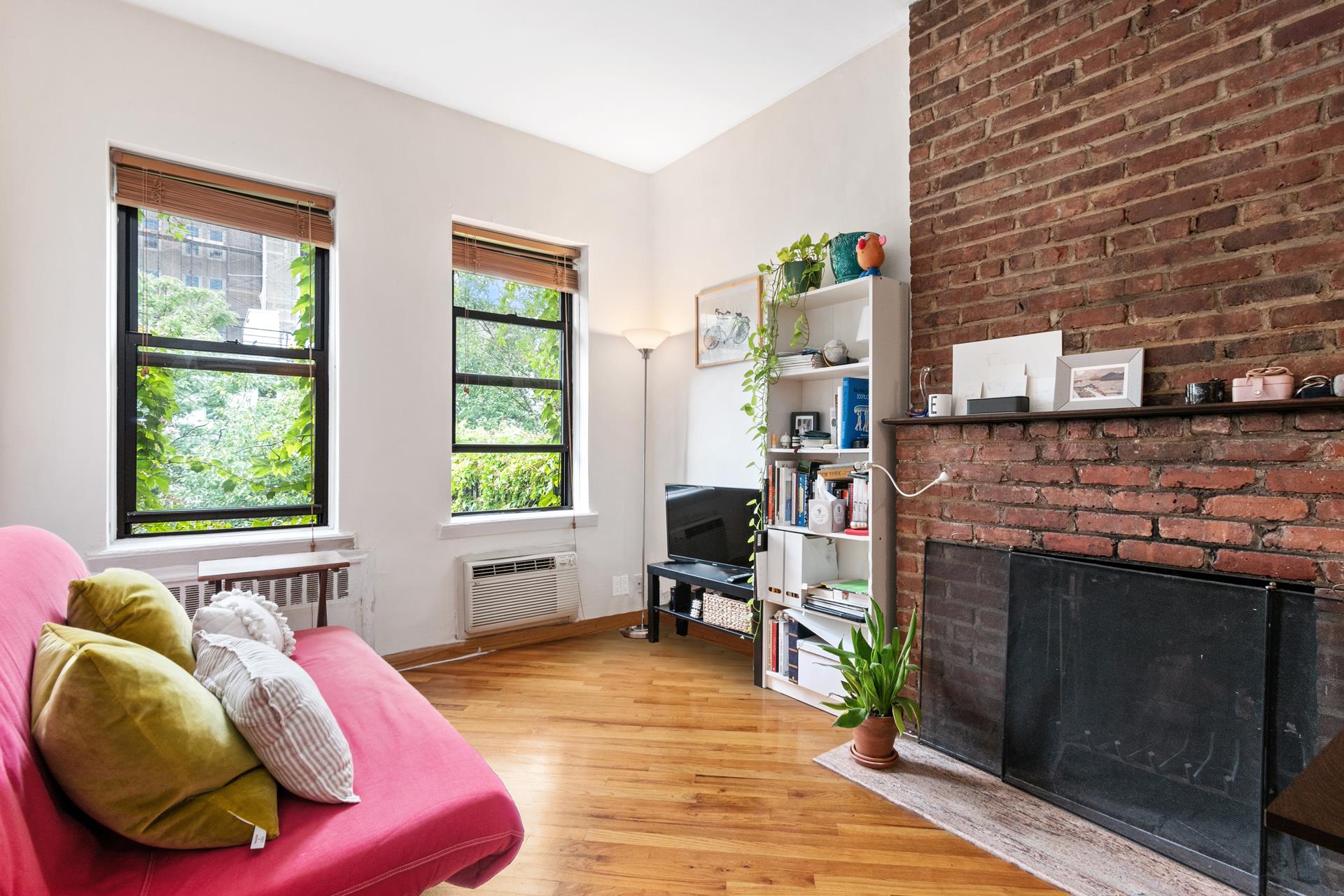 a bed room with furniture and a fireplace