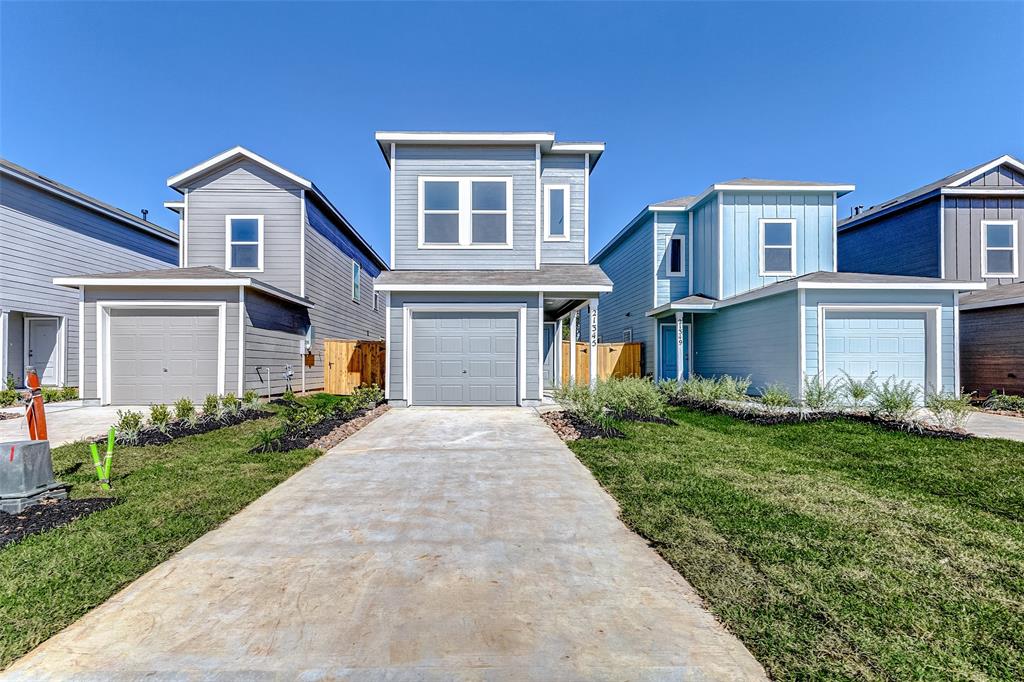 front view of a house next to a yard