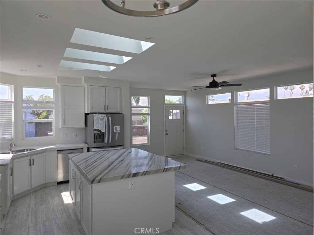 a kitchen with a sink and refrigerator