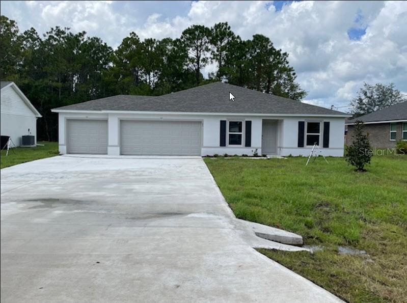 front view of a house with a yard