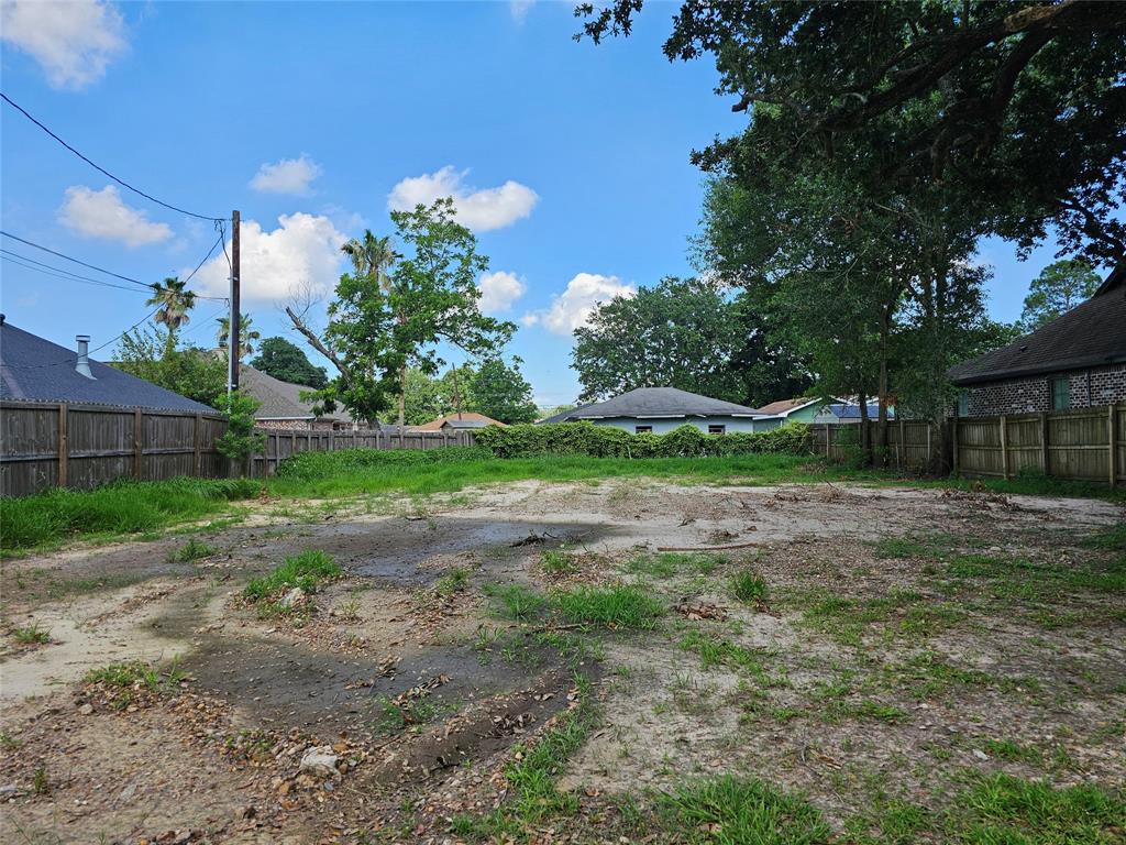 a view of a yard with tree s