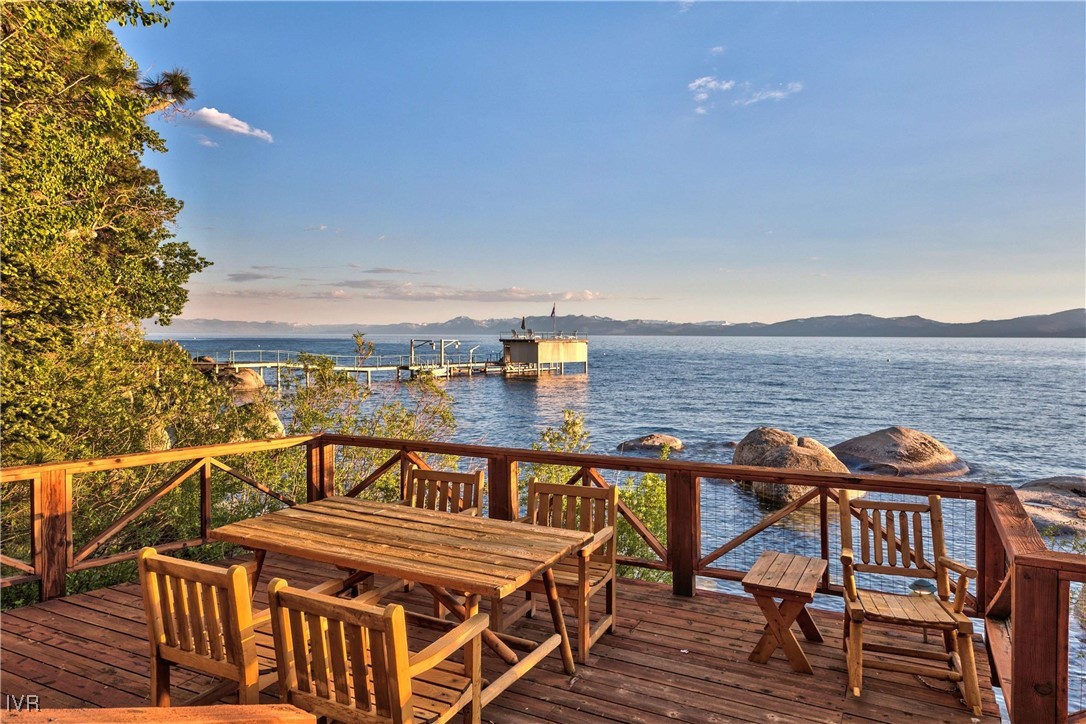 a view of a roof deck with patio