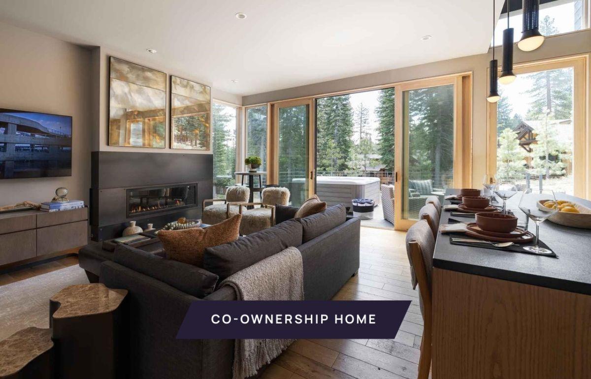 a living room with furniture a flat screen tv and a large window