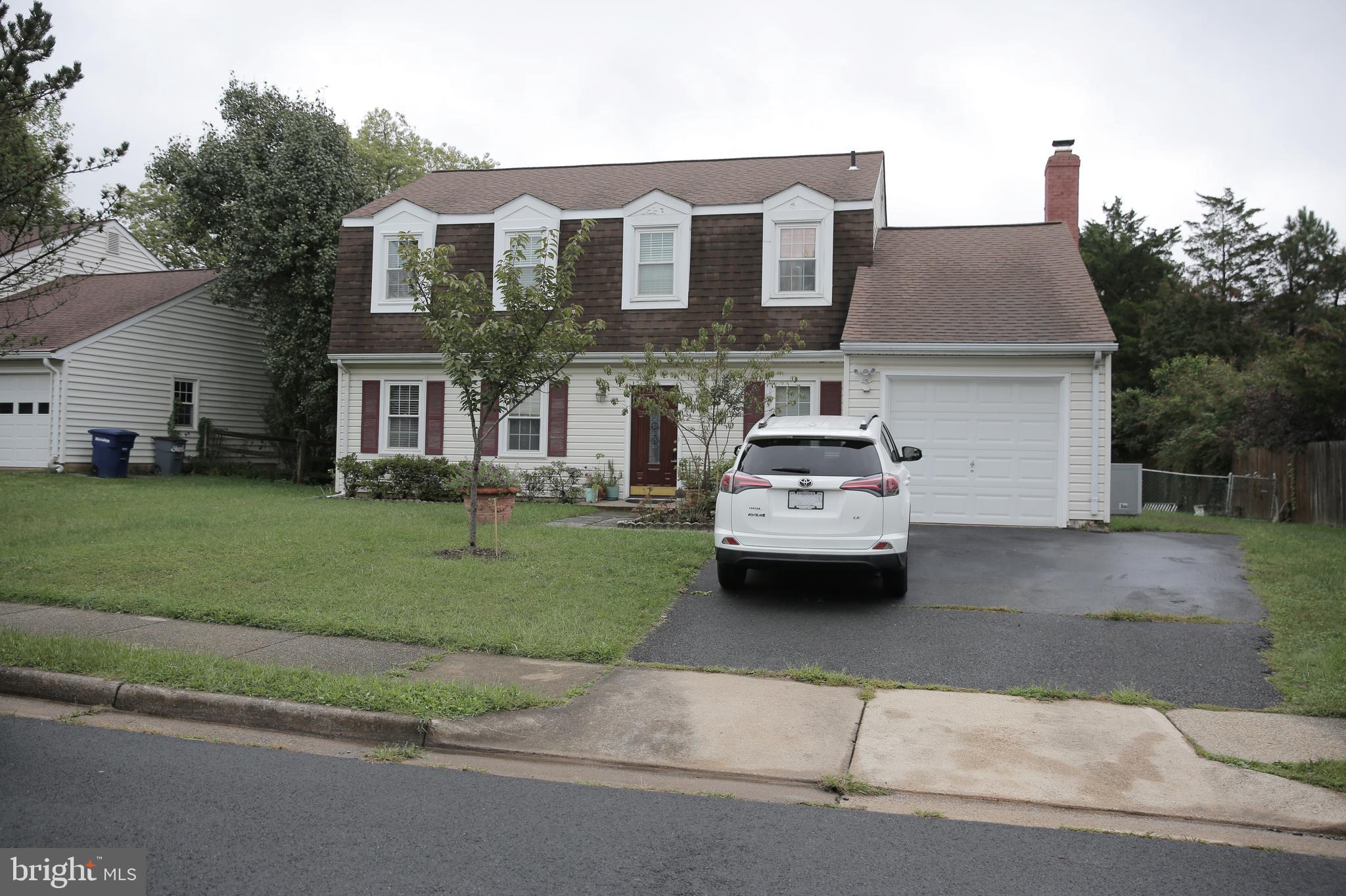 a car parked in front of a house