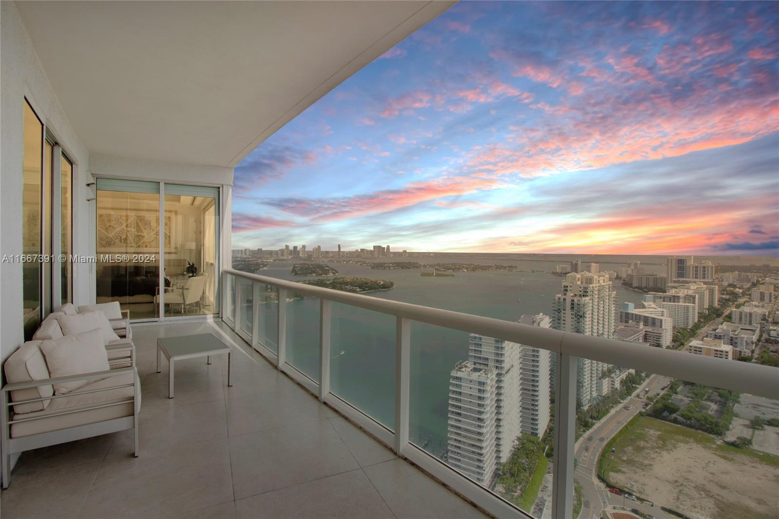 a view of roof deck with furniture