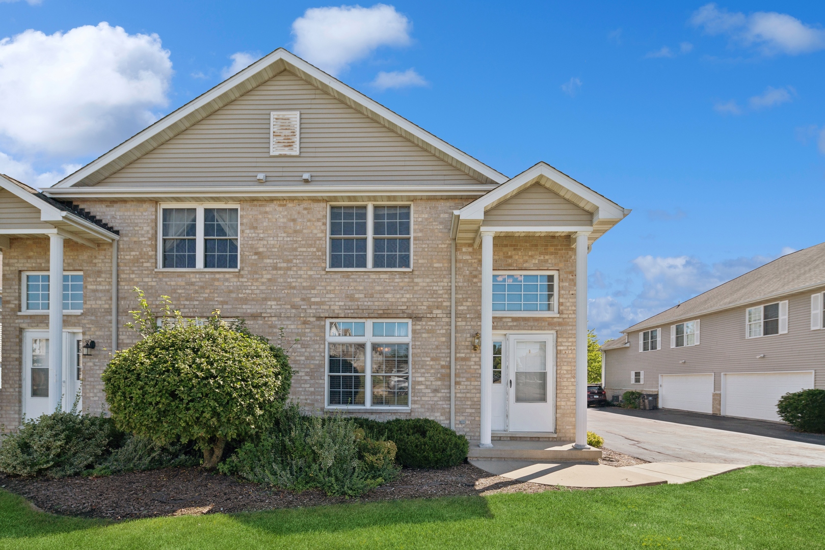 a front view of a house with a yard