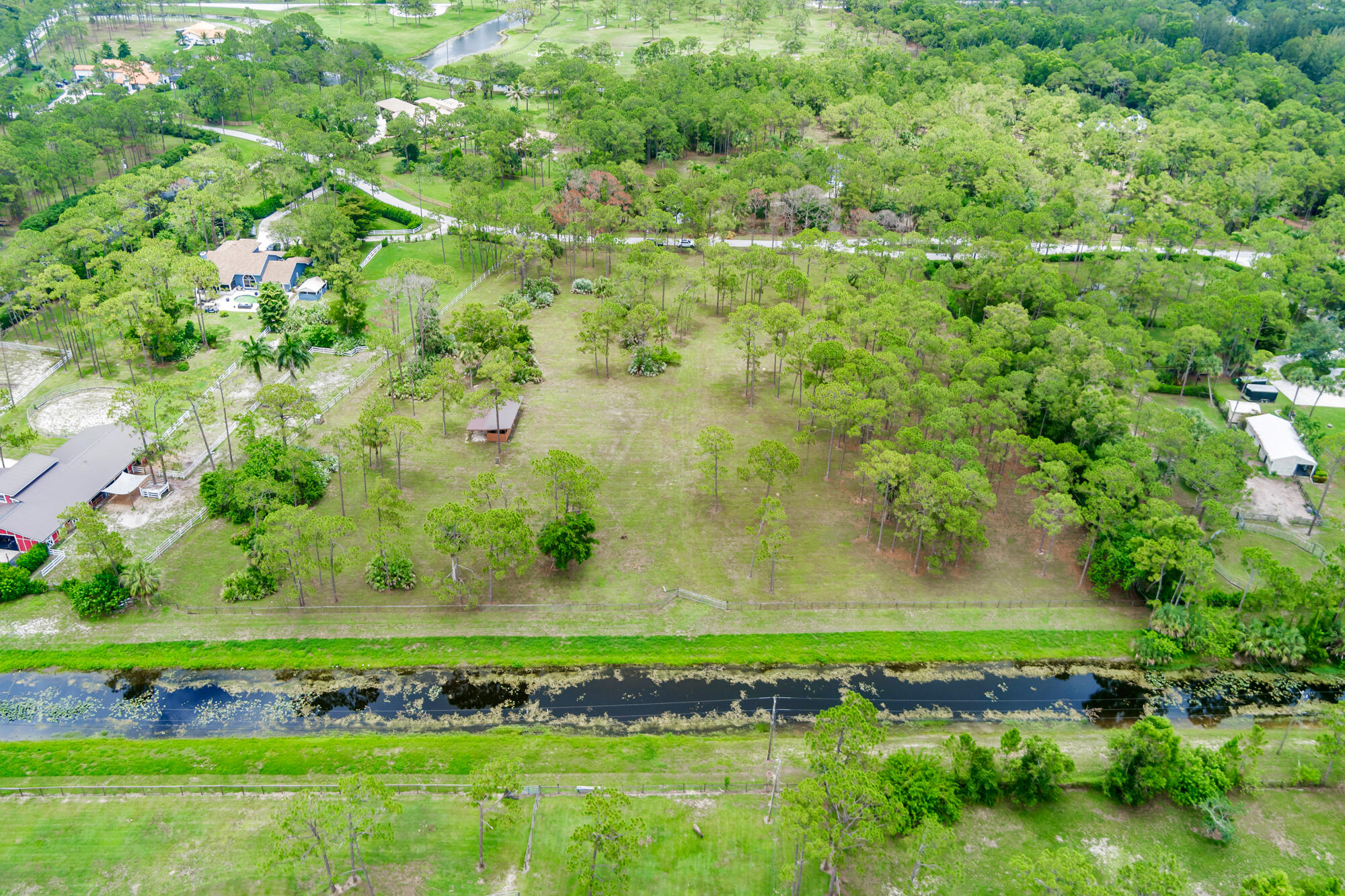 a view of a lake with a yard