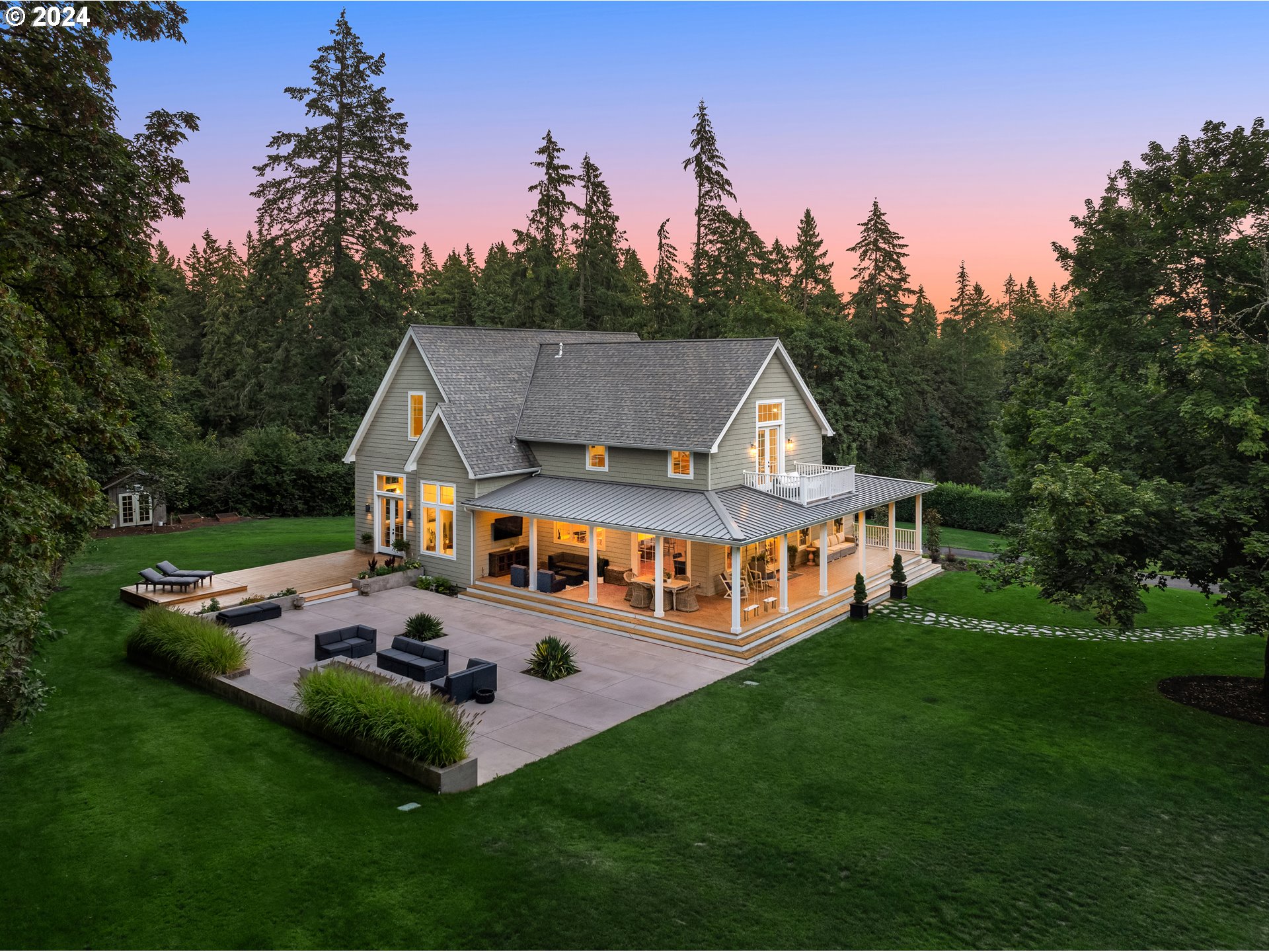 a aerial view of a house with swimming pool yard and outdoor seating