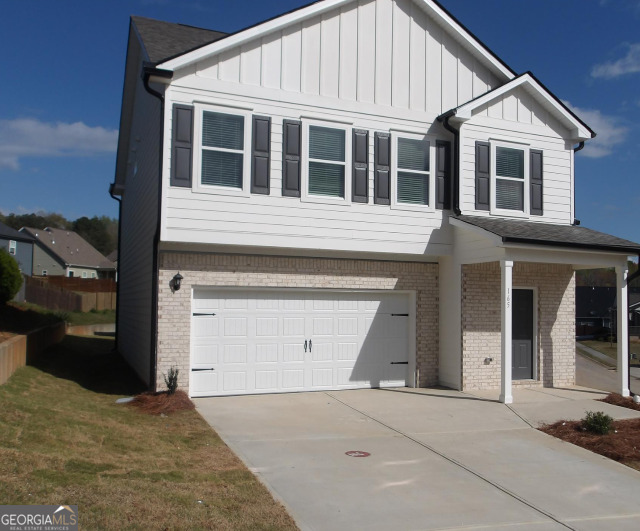 a view of a house with a parking space