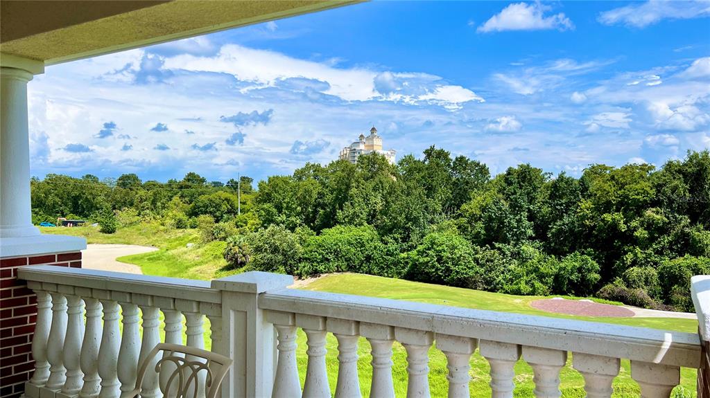 a view of a balcony with wooden fence