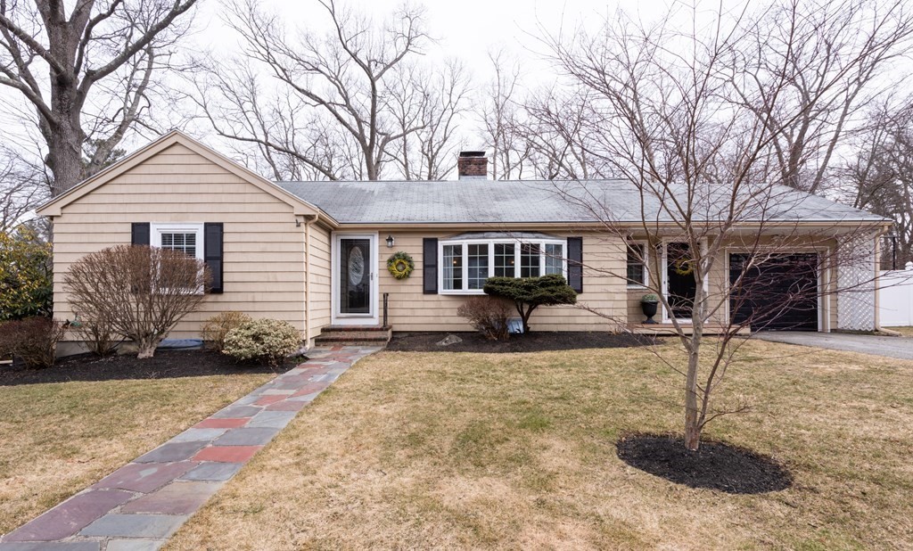 front view of a house with a yard