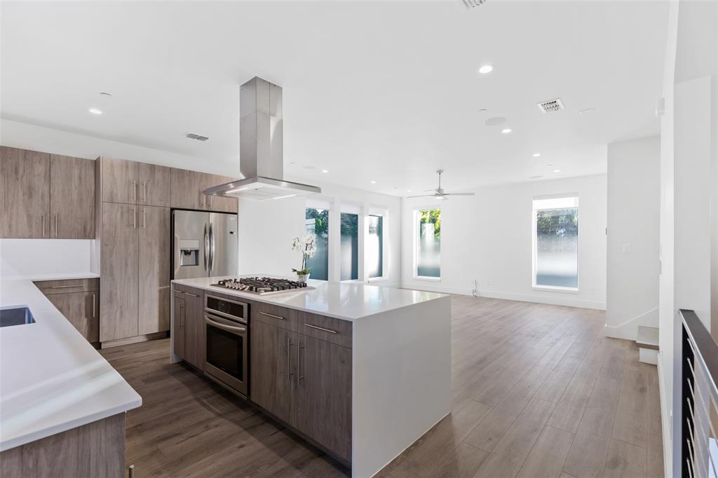 a kitchen with a stove and a refrigerator