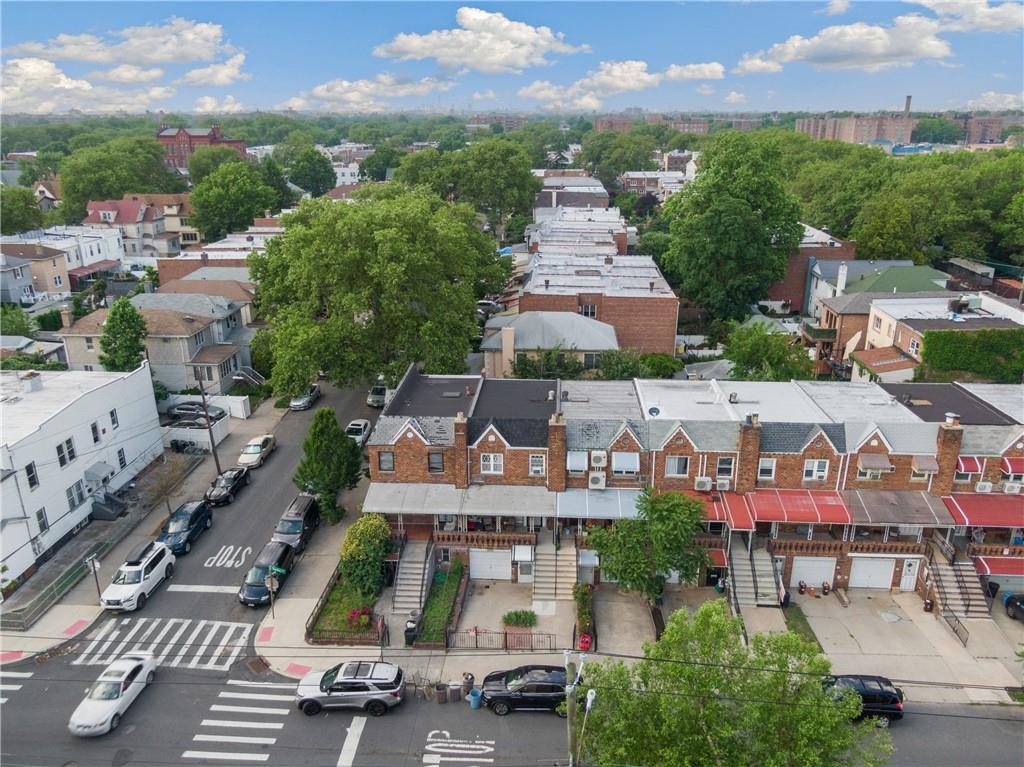 an aerial view of multiple houses with yard