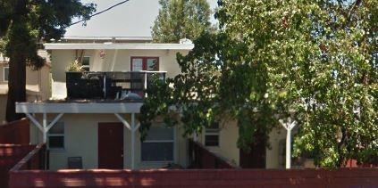 a front view of a house with chairs