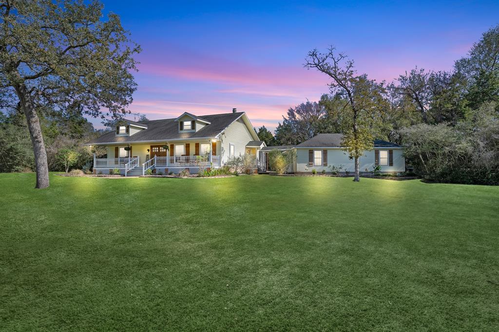 a view of a house with a big yard