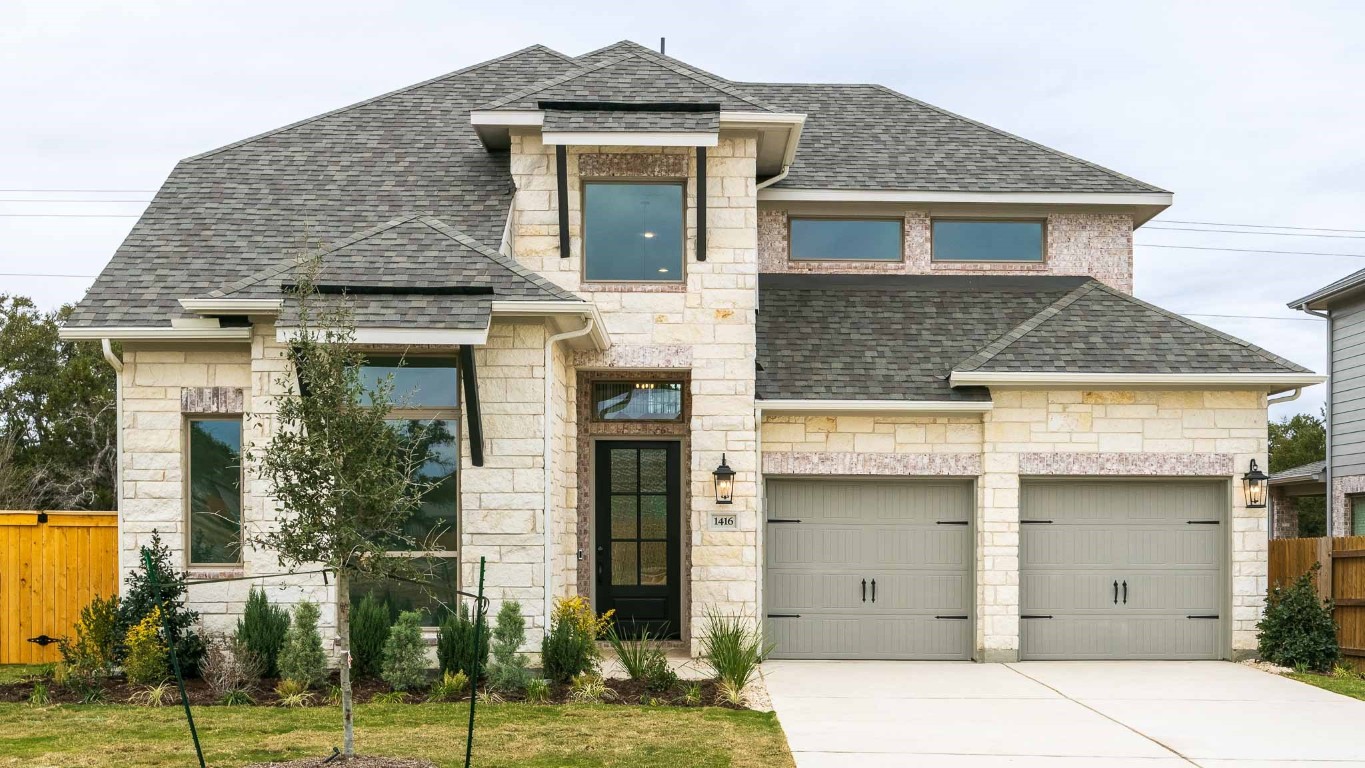 front view of a house with a yard