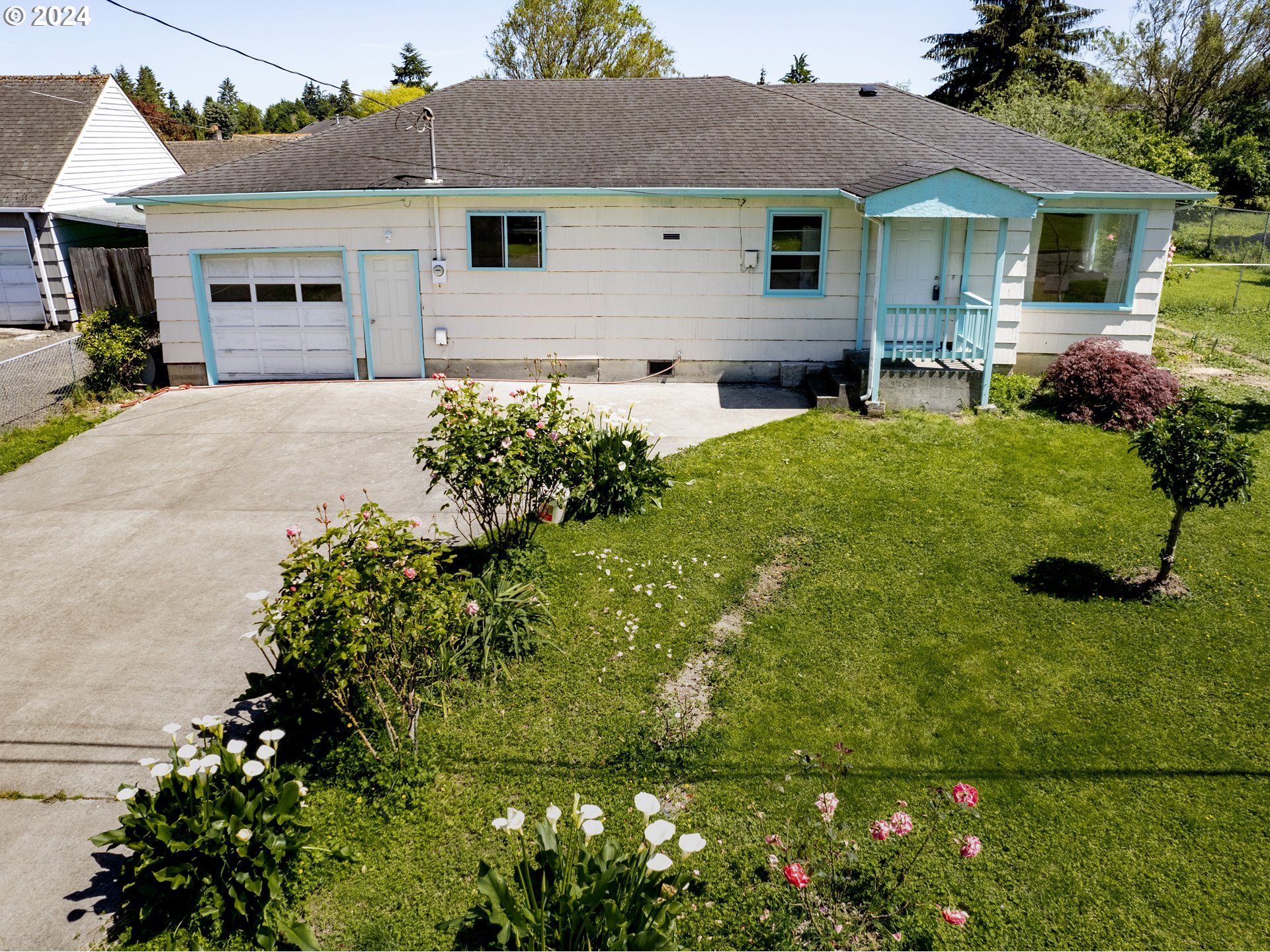 a front view of house with yard and green space