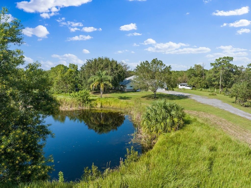 a view of a lake with houses in the back