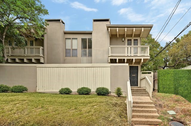 front view of a house with a yard