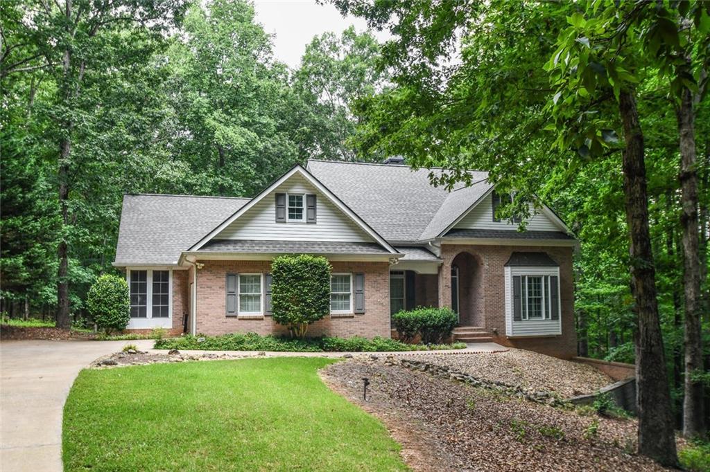 front view of a house with a yard