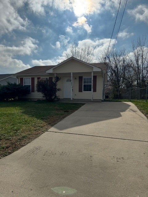 a view of a house with a yard