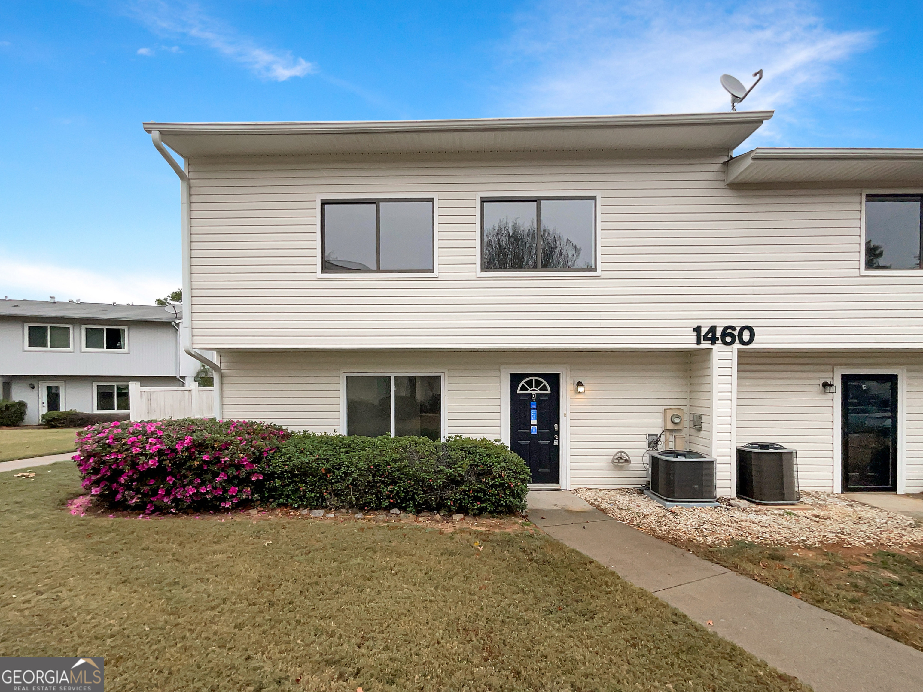 a front view of a house with a garage