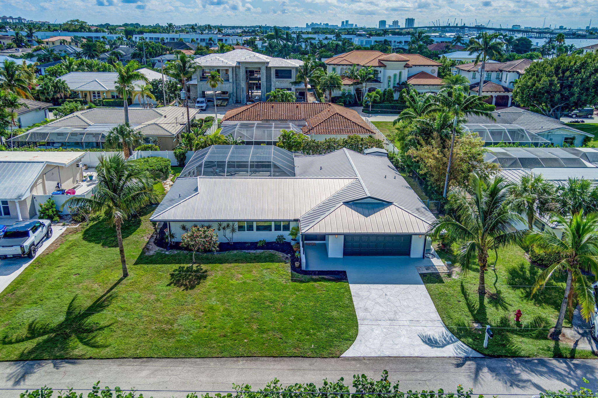 an aerial view of a house with garden space and street view